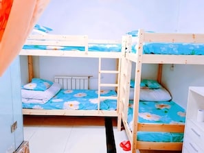 A bunk bed room with a ladder, a radiator, and a white dresser. - Tianjin Xinsentang Youth Hostel (Heping District)