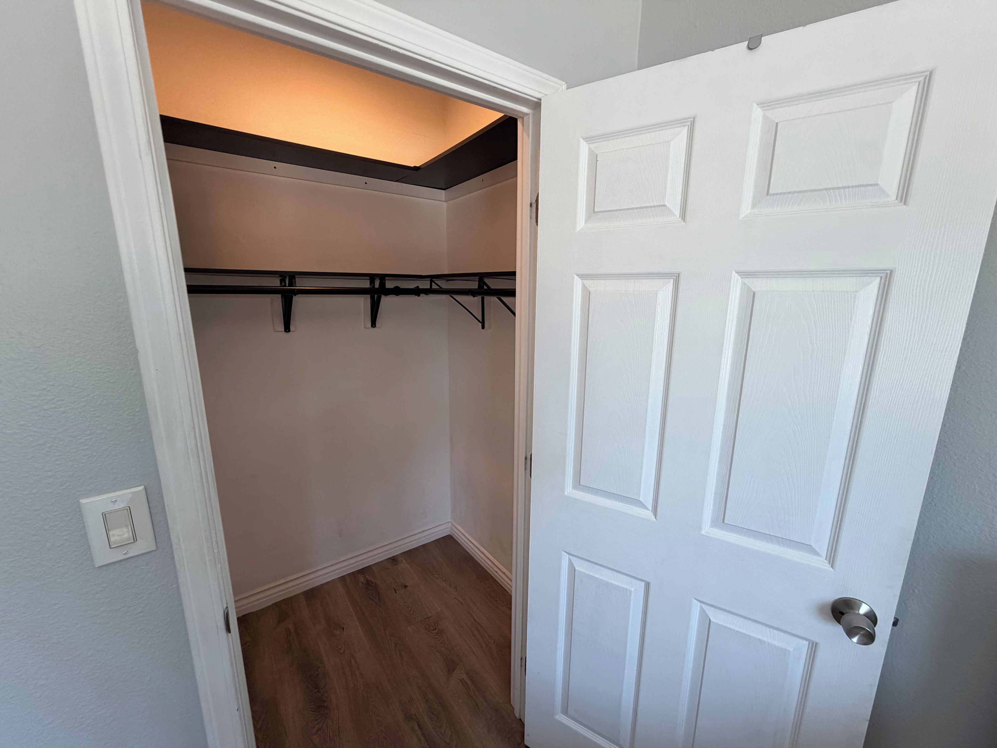A closed white door with a standard lock and a doorknob.