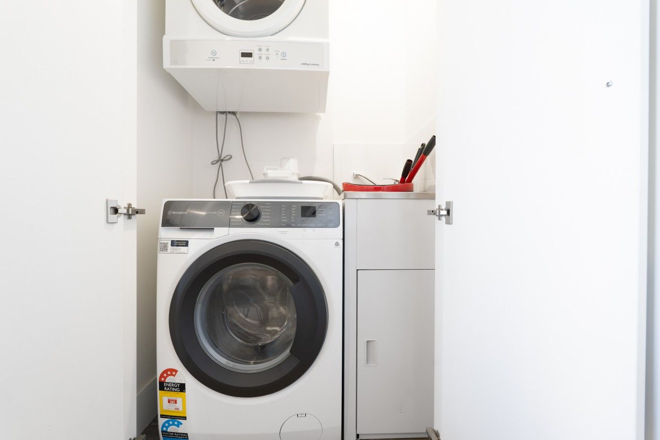 Enjoy the convenience of an in-apartment laundry, complete with a neatly fitted washing machine and dryer to help keep your clothes fresh throughout your stay.