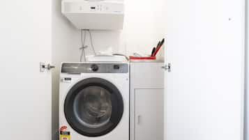 Enjoy the convenience of an in-apartment laundry, complete with a neatly fitted washing machine and dryer to help keep your clothes fresh throughout your stay.