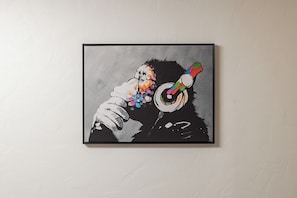 A framed artwork on a textured wall. - Downtown Anchorage Studio - King Bed -Sleeps 4 (Anchorage)