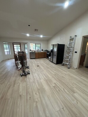 A spacious kitchen with a central island, a refrigerator, and a dishwasher. - Charming 3 Bedroom 2 Bath Home in Fountain Hills with Pool and Mountain Views! (Fountain Hills)