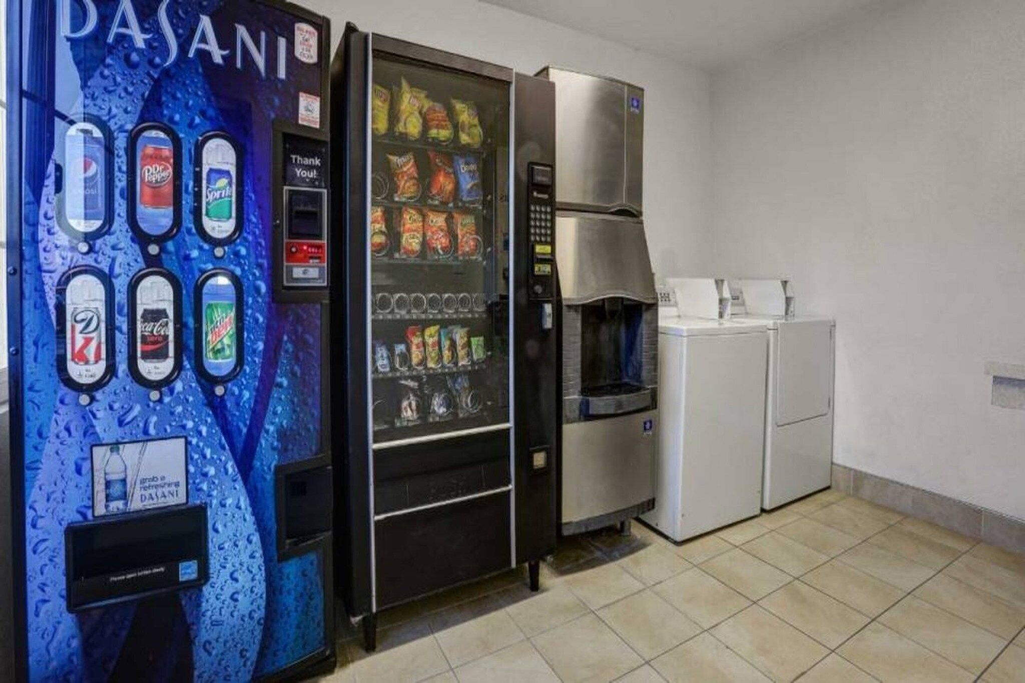 A vending machine with various drink options and a water dispenser.