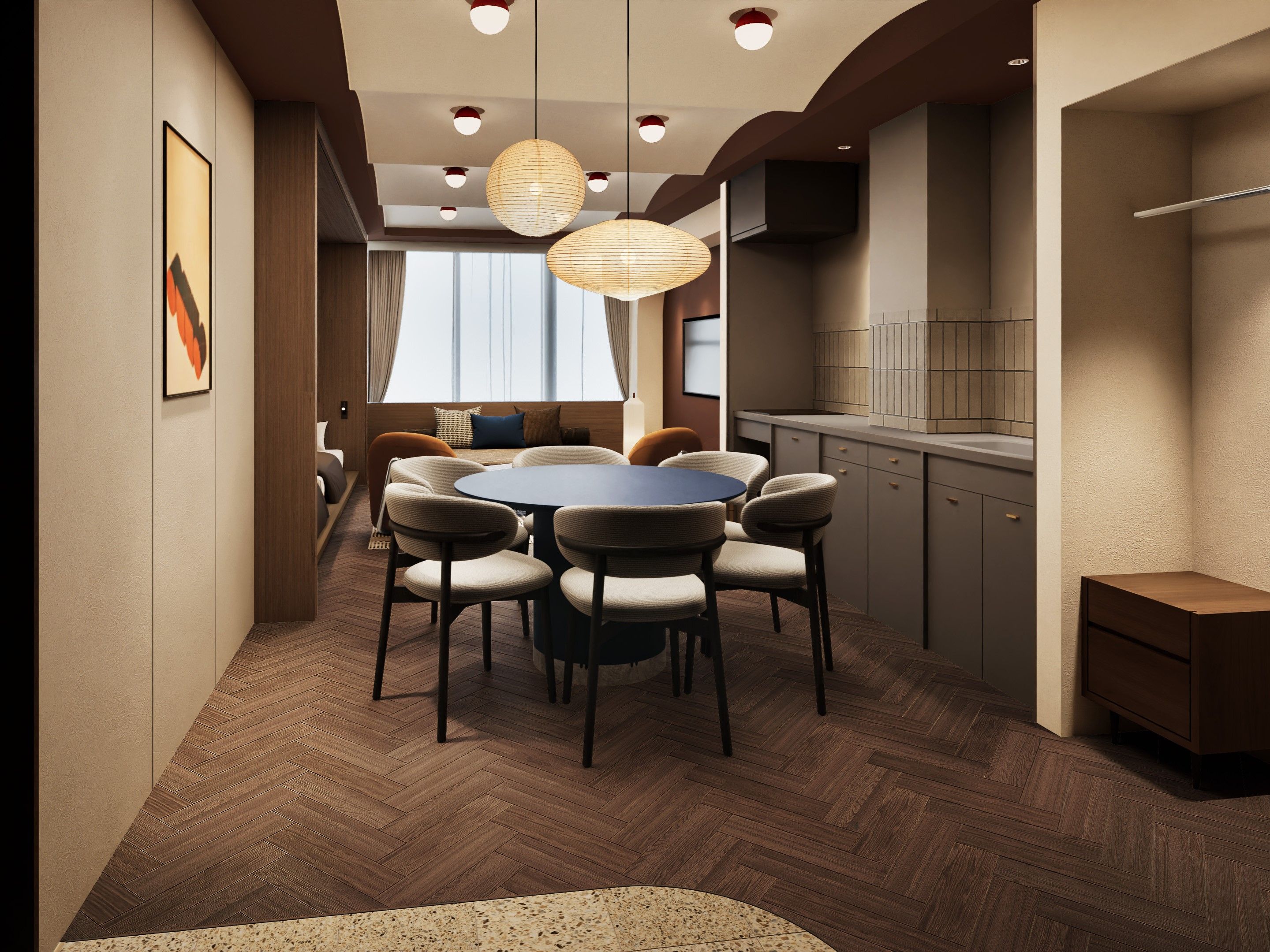 A modern dining area with a round table and chairs, a kitchen with wooden cabinets, and pendant lighting.