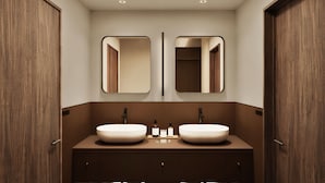 A modern bathroom with two sinks, mirrors, and a towel rack. - illi Vau Hamamatsucho (Minato-ku)
