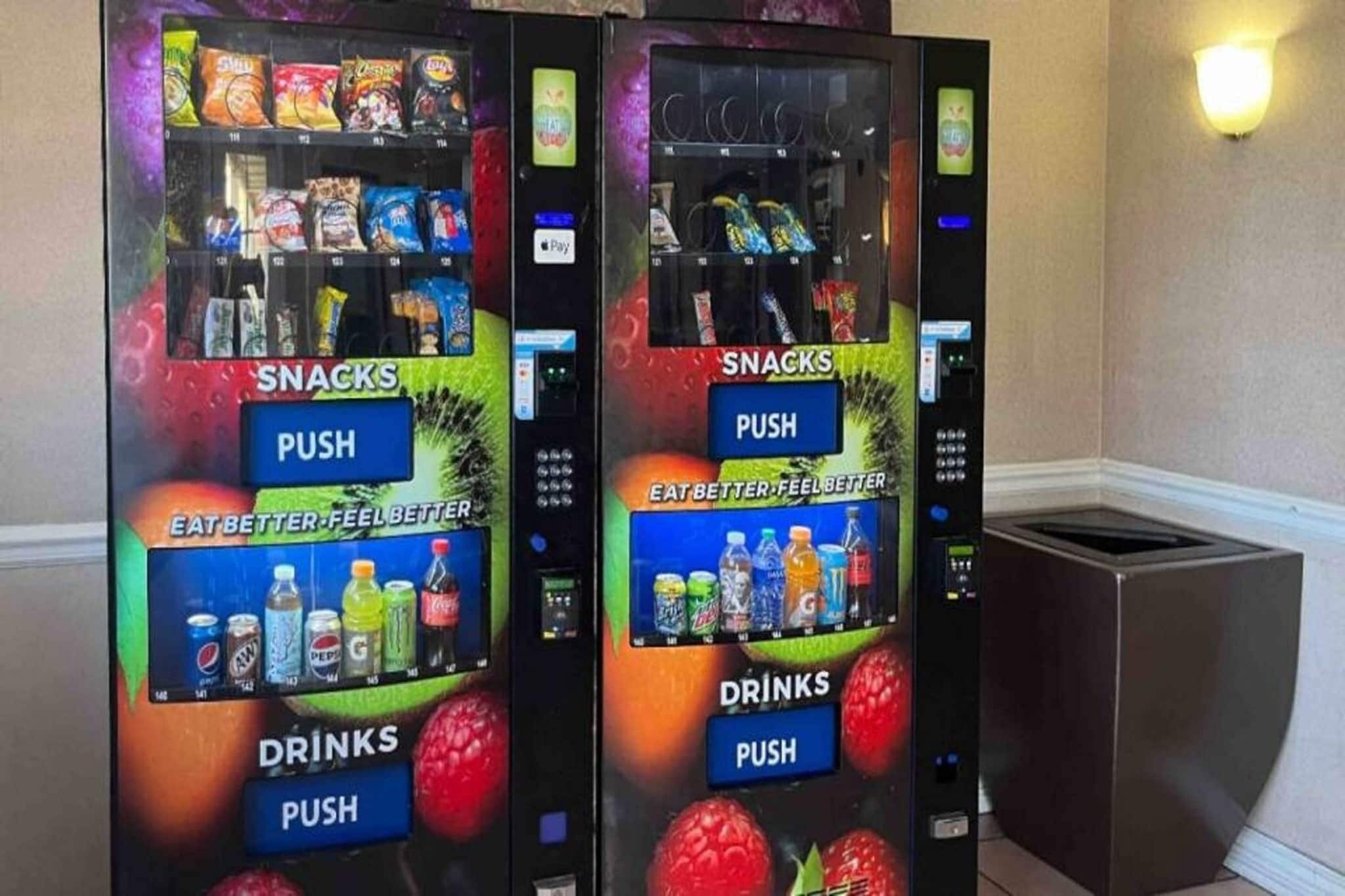Two vending machines with snacks and drinks, labeled with 'SNACKS' and 'DRINKS' sections, and a 'PUSH' button.