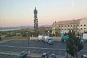 A parking lot with a building in the background.