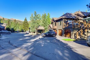 A residential street with houses, a parked car, and a mountain backdrop. - Steps to Dtwn & Peak 9 Lifts! Hot Tub Hideaway (Breckenridge)