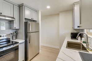A modern kitchen with stainless steel appliances, a built-in oven, and a microwave. - 1 Mi to Beach! Walkable Extended Base in Monterey (Monterey)