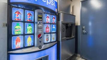 A vending machine with a Pepsi logo and various beverage options.
