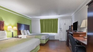 A hotel room with two beds, a desk with a chair, a television, and a window with curtains. - Elegant 2 Queen Beds Room|Free Wifi (Kingsburg)