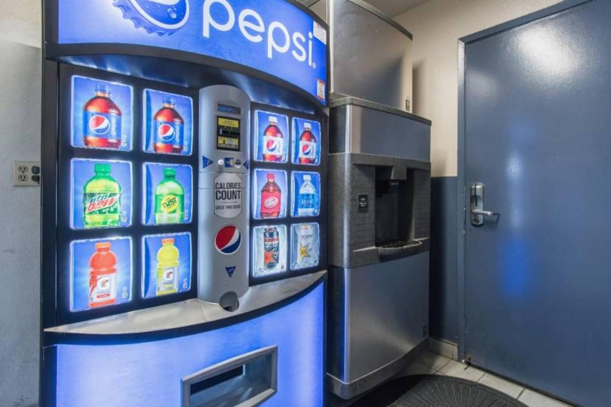 A vending machine with a Pepsi logo and various beverage options.