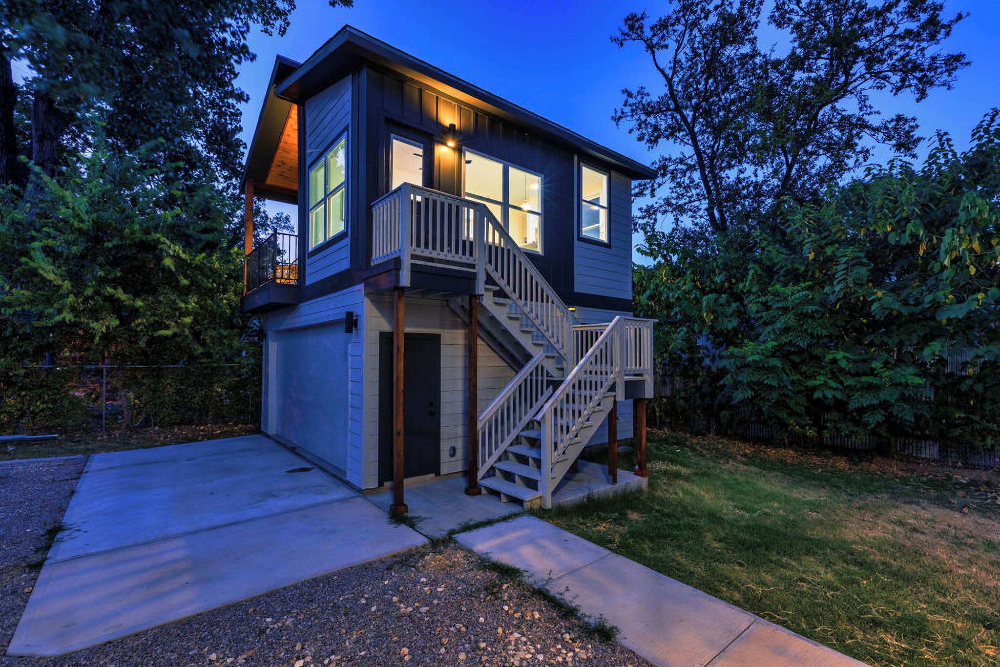 A two-story house with a front entrance, a staircase, and a garage.