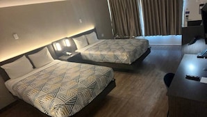 A hotel room with two beds, a desk, and a window with curtains. - 2 Full Beds | Mobil Access Tub Nsmk Micfridg (Glendale)