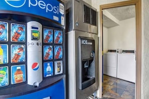 A vending machine with various beverage options and an ice dispenser.