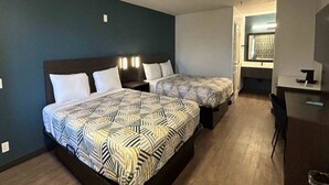 A hotel room with two beds, a desk, and a chair. - 1 King Bed | Non-Smoking, Micfridge (Lake Elsinore)