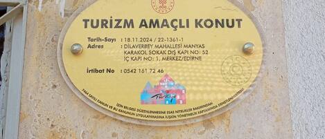 A sign with the text 'TURIZM AMAÇLI KONUT' indicating a tourism-oriented accommodation.