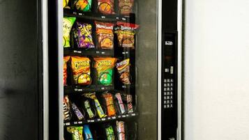 A vending machine stocked with various snack brands.