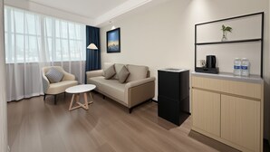 Family Triple Room, Multiple Beds, Housekeeping, City View | Living area | Printers - Xinlvyige Hotel (Urumqi)
