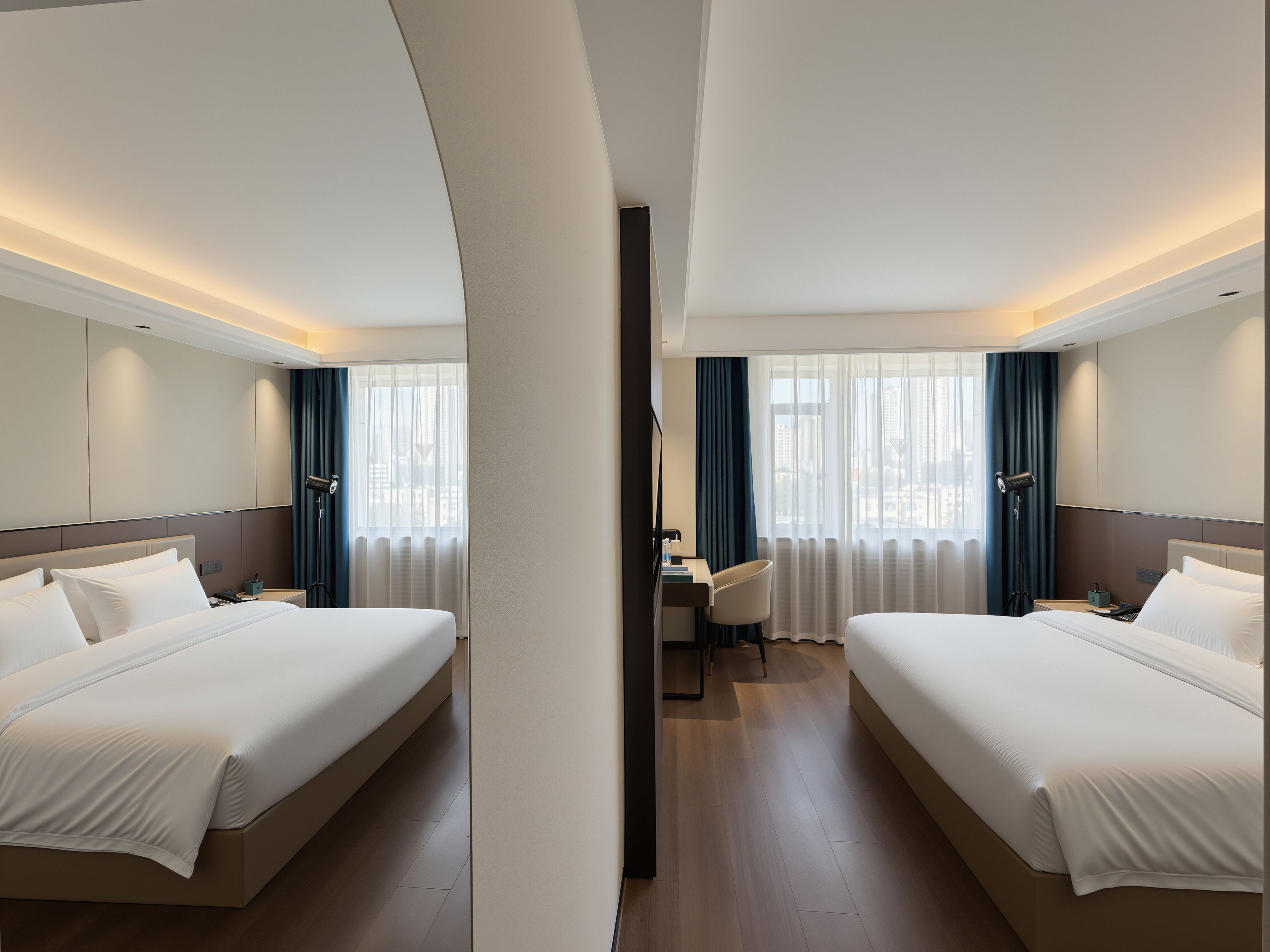 A hotel room with two beds, a desk, and a chair.