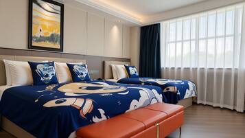 A hotel room with two beds, a bench, and a large window with curtains.