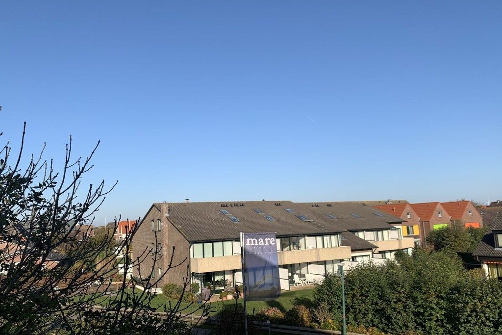 Un bâtiment moderne avec une enseigne sur laquelle on peut lire le mot « mare ».