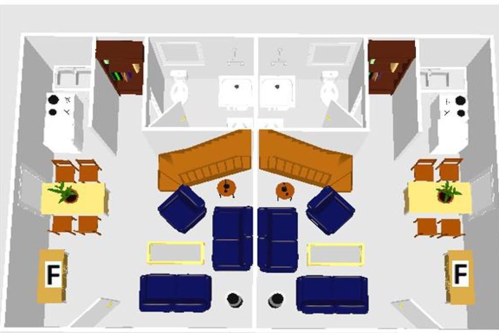 Ein Hotelzimmer mit zwei Betten, einem Schreibtisch, einem Sessel, einem kleinen Tisch und einer Couch.