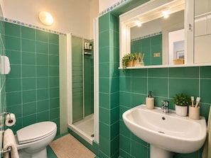 A bathroom with a toilet, sink, and shower. - Casa Amanda: A Window onto the Sea in the Portofino Marine Park (Pedale)