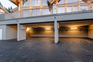 A multi-level building with a covered parking area. - Cabin in Niederwölz with sauna (Niederwölz)