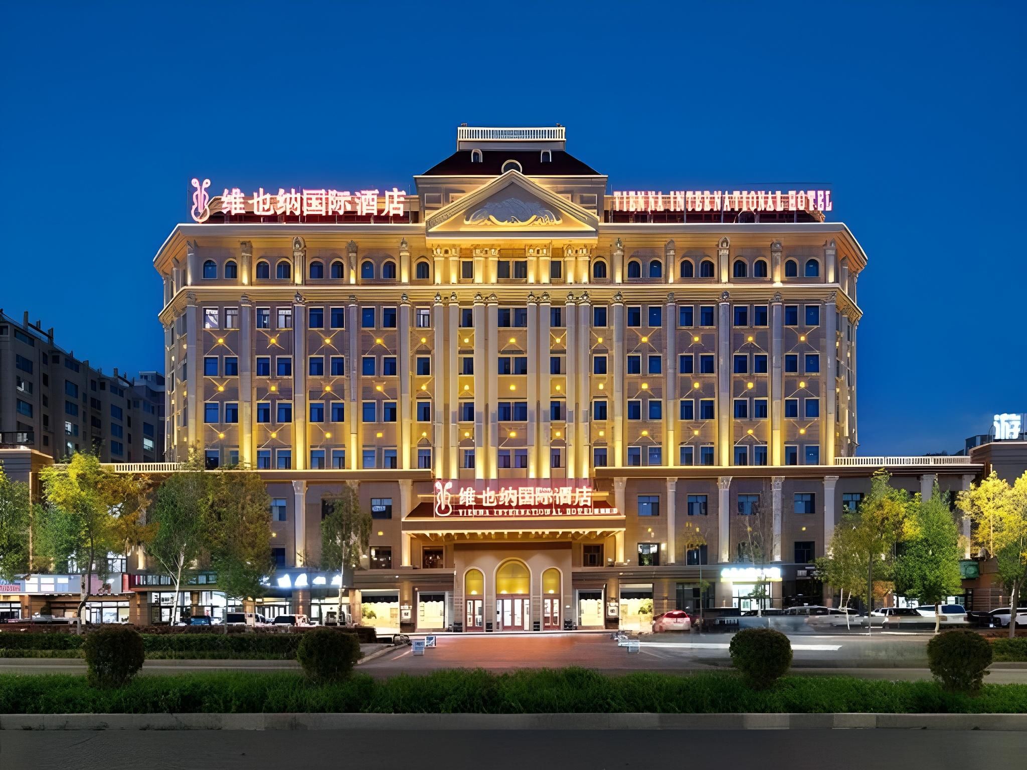 A large, multi-story hotel with a symmetrical facade, numerous windows, and a central entrance.