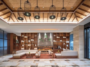 A modern interior with a fireplace, wooden shelving, and a seating area.