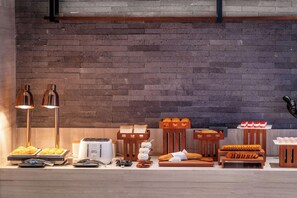 A breakfast buffet with various food items and a toaster.