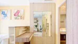 A modern bathroom with a wooden vanity, a mirror, and a sink. - Noble Remix Bangkok (Krung Thep Maha Nakhon)