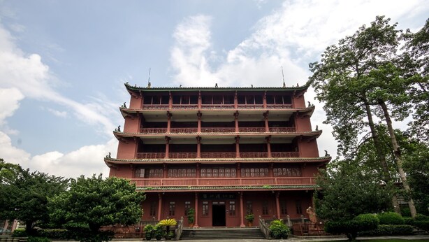 A multi-story traditional building with a symmetrical facade, multiple balconies, and a central entrance. - Yizhi Meiju (Guangzhou)