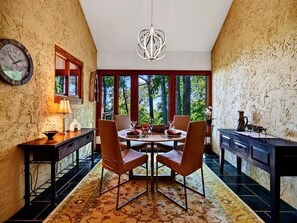 A dining area with a round table, chairs, and a chandelier. - Merryland with Wintergreen Advantage (Wintergreen)