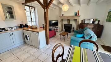 A compact living space with a kitchen, dining area, and seating area.