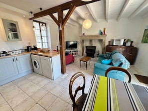 A compact living space with a kitchen, dining area, and seating area.