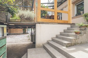 A multi-level building with a staircase leading to an upper floor. - Jana's Garden House With Hot Tub (Kamnik)