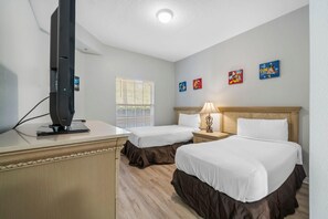 A hotel room with two beds, a television, a window with blinds, and wall art. - 2103 Spacious 2/2 Resort Condo Near Disney (Orlando)