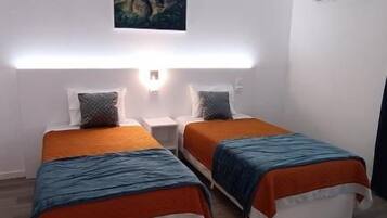 Family Suite, Patio, Courtyard View | Soundproofing, iron/ironing board, WiFi (free)