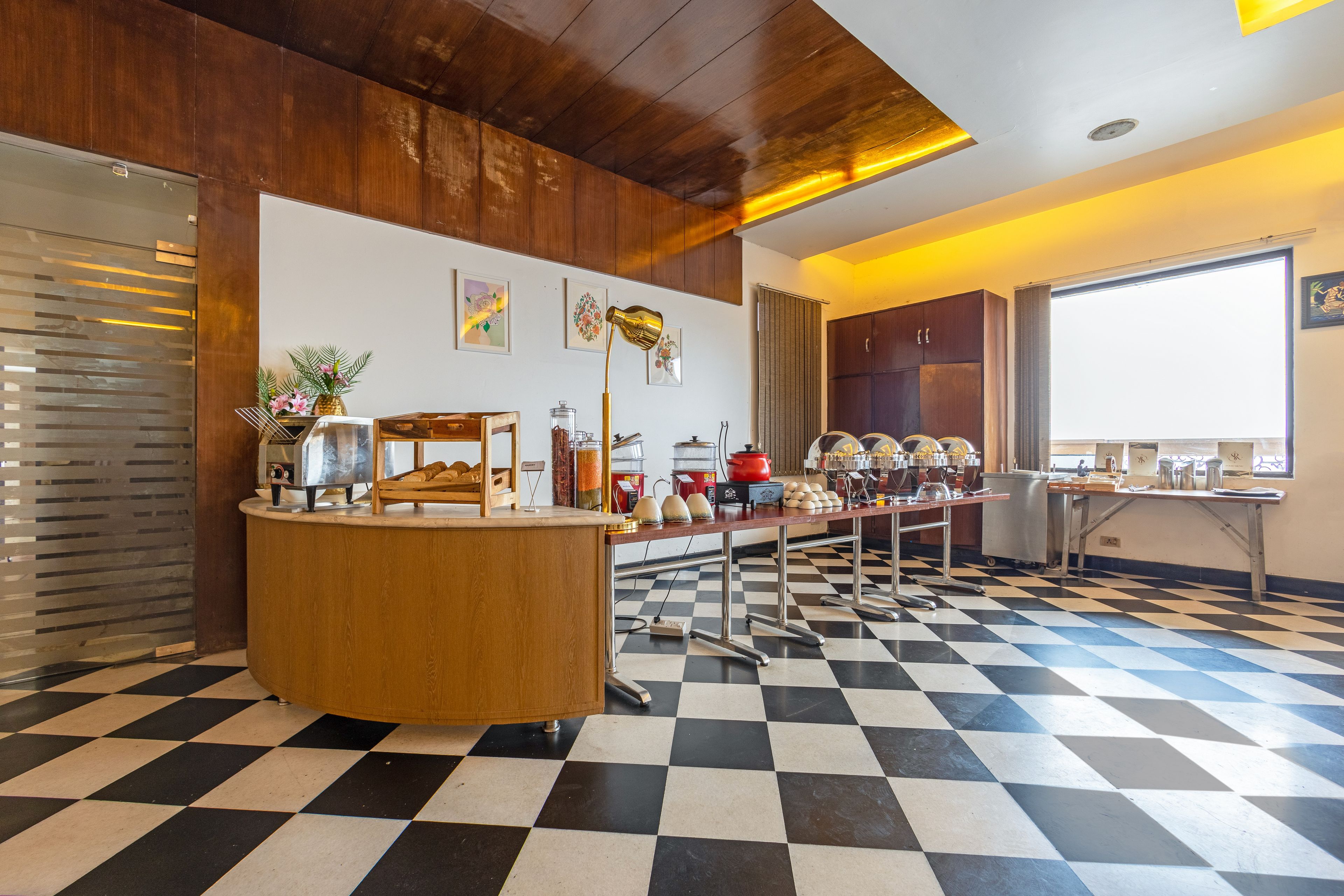 A checkered floor, a reception desk, and a window with a view.