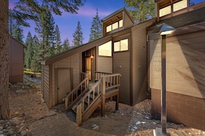 A multi-level wooden cabin with a staircase leading to a door marked '6029'. - Indian Hills Charming Townhome 3 Bedroom Townhouse (Truckee)