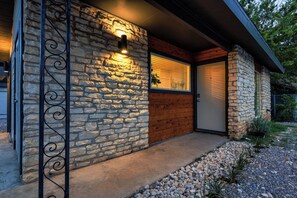 A stone exterior with a wooden door and a metal gate. - 4 Mi to Downtown Austin! Quiet & Quaint Home (Austin)