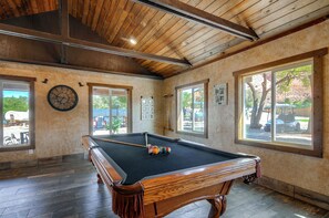 A pool table in a room with wooden beams on the ceiling, large windows, and a clock on the wall. - 30 Mi to Zion! Mtn-view Tiny Home Escape (Kanab)
