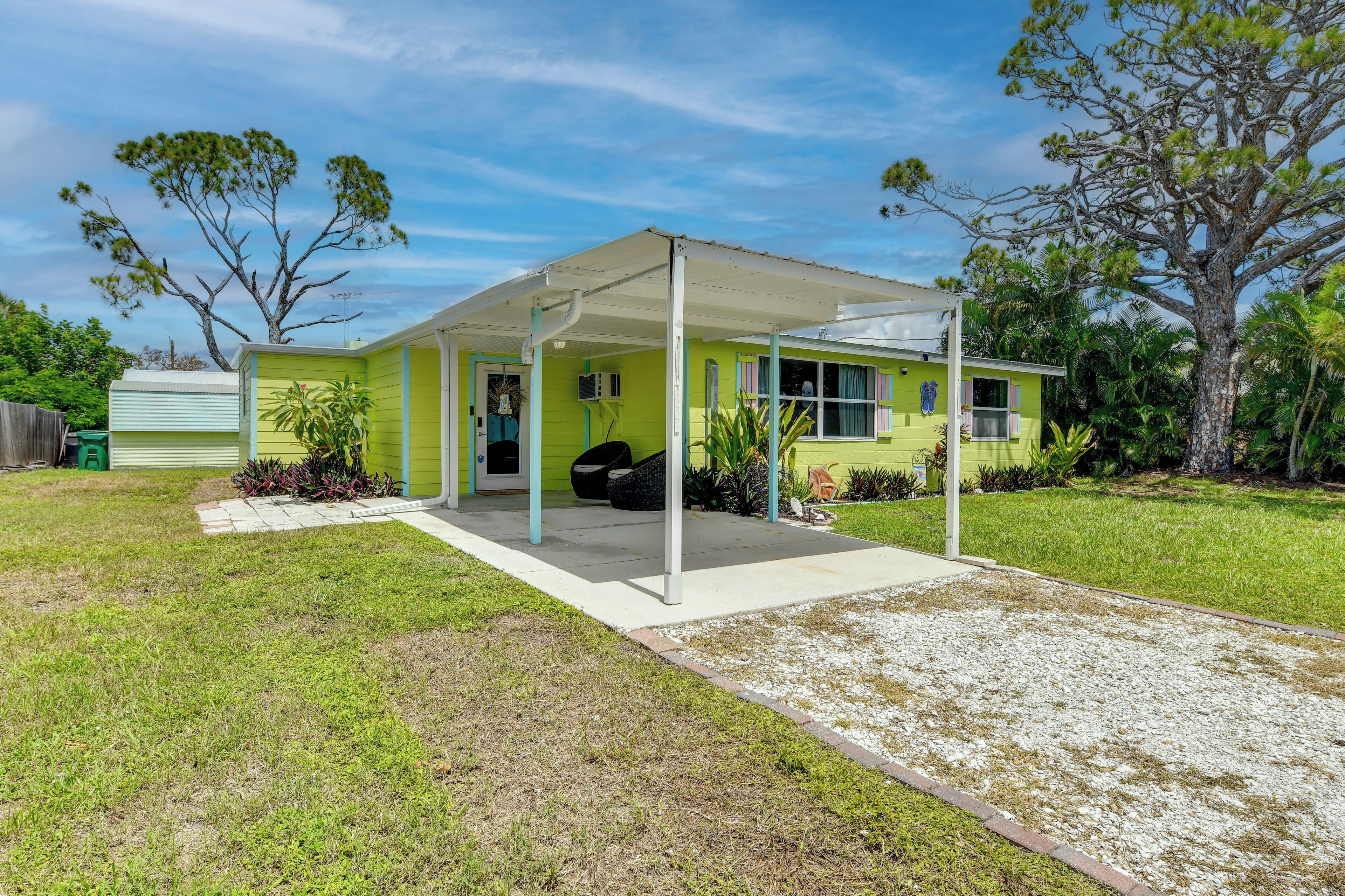 A single-story house with a covered patio, a front door, and a small porch area.