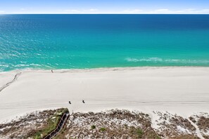 A beach with a clear view of the ocean and a sandy shoreline. - Grand Panama 2-104 | 2BR + Bunks | Sleeps 7 (Panama City Beach)