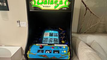 A retro arcade machine with a vibrant display and a classic design.