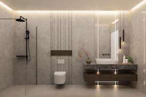 A modern bathroom with a shower, toilet, vanity, and a large mirror. - F&R Zimmervermietung  (Tappenbeck)