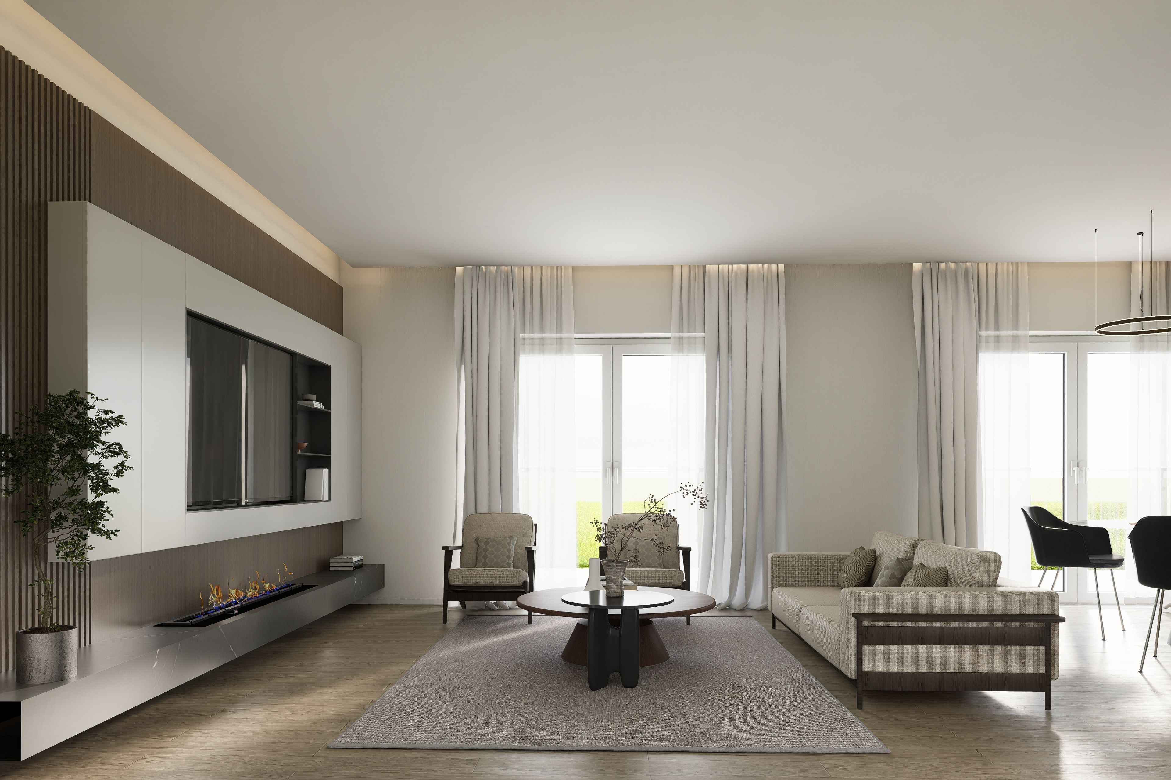 Ein modernes Wohnzimmer mit einem Flachbildfernseher, einem runden Couchtisch und einem Sofa.