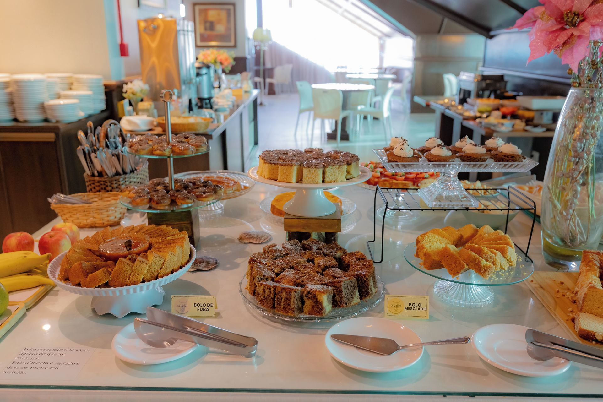 A buffet with various desserts and a coffee station.